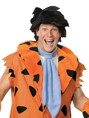 Person wearing a Fred Flintstone costume with an orange vest, black pants, and a blue necktie.