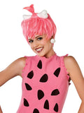 Person wearing a pink wig with a white bow and a matching dress with black shapes on a white background