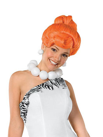 Person wearing an orange wig and white and black outfit on a white background